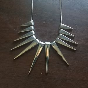 Spiked silver necklace .